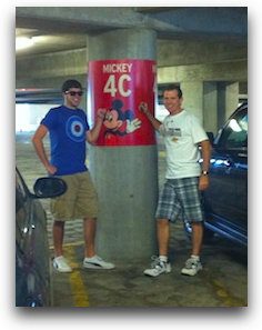 pic of steve and kyle standing next to sign that shows mickey mouse and 4C so we can remember where we parked at disneyland