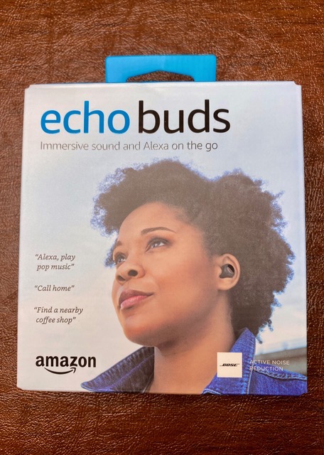 Echo Buds outside box showing woman wearing them