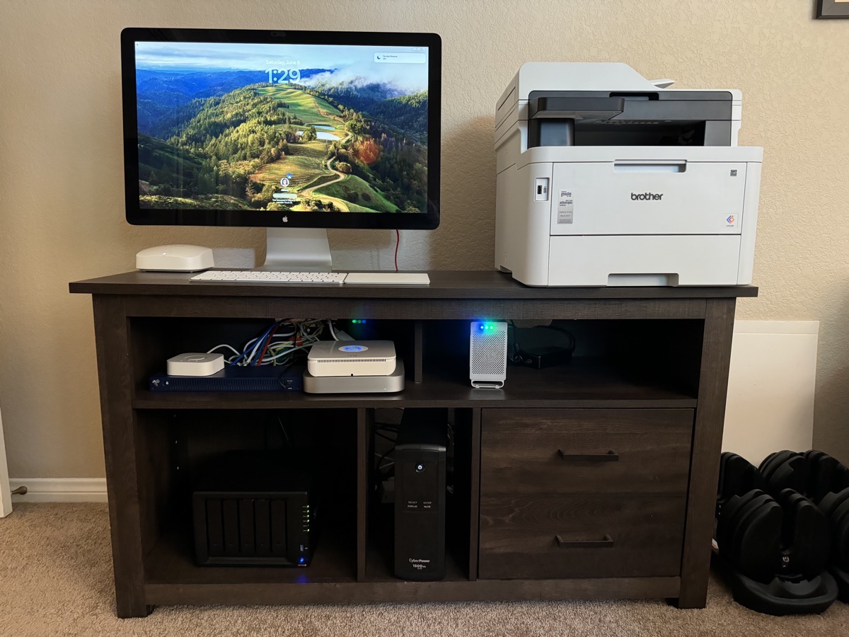 Brother color laser printer L3780 next to Mac mini and 27 inch cinema display and Synology.