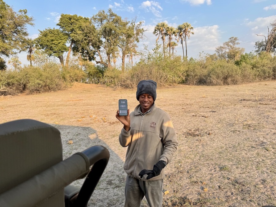 Spotter on the ground happily holding up Steve's iPhone