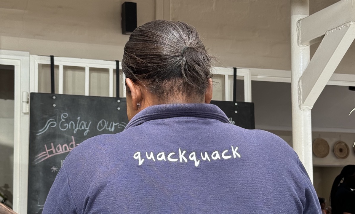 Quackquack on back of shirt.